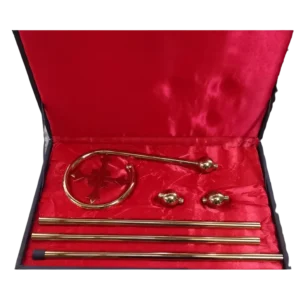 Brass bishop's crosier pastoral staff with curved cross-decorated top and red-lined carrying case.